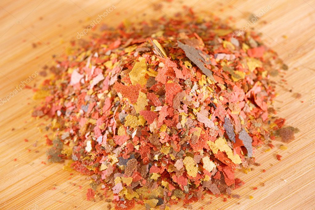Tub of tropical fish flake food